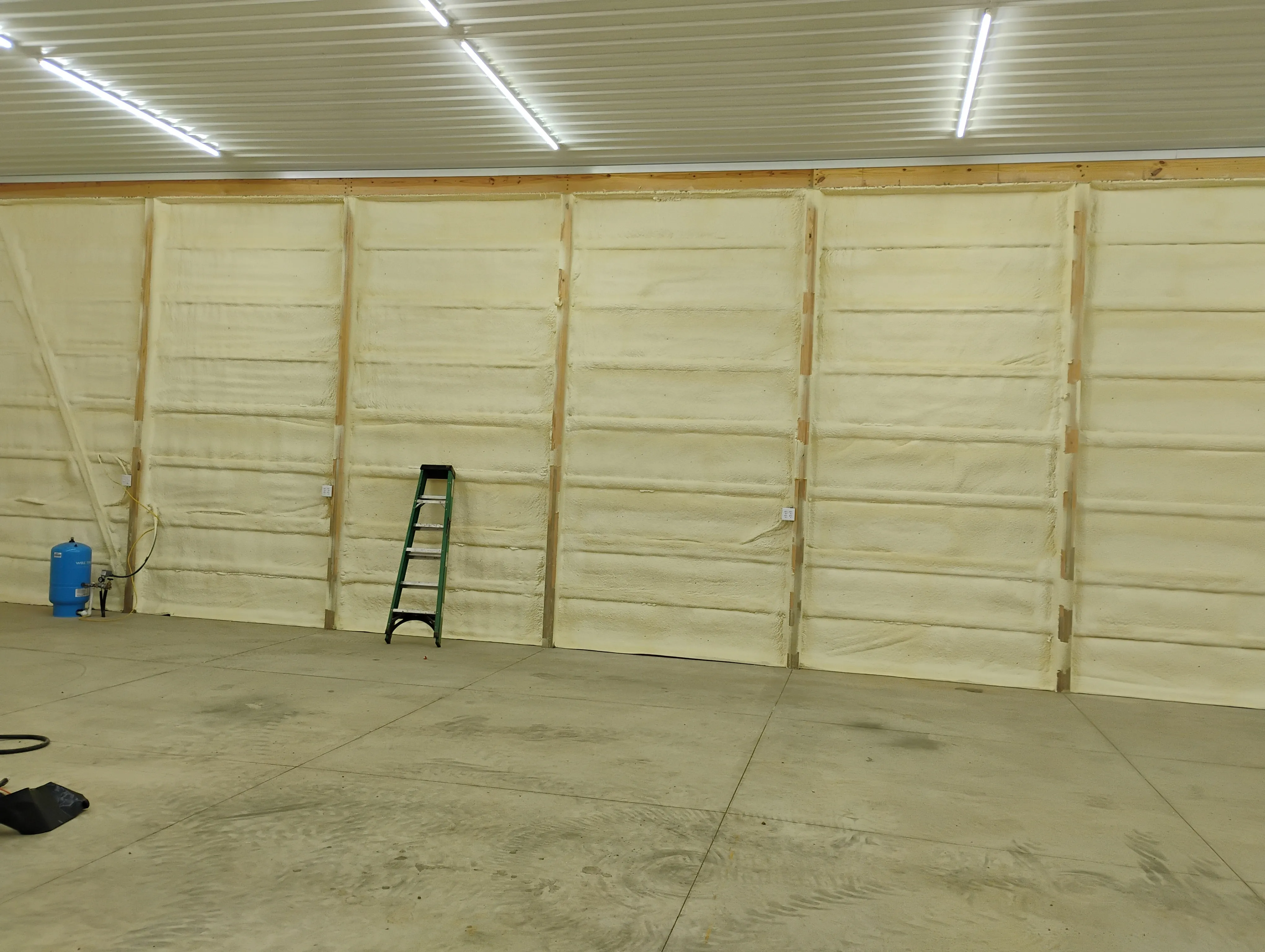 Metal building interior with insulated tan wall panels